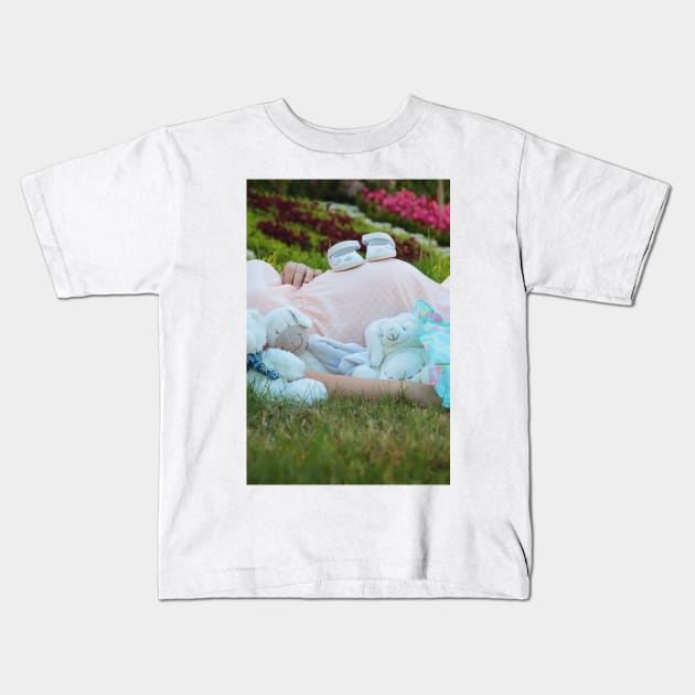 pregnant woman in the park surrounded by stuffed toys Kids T-Shirt by psychoshadow